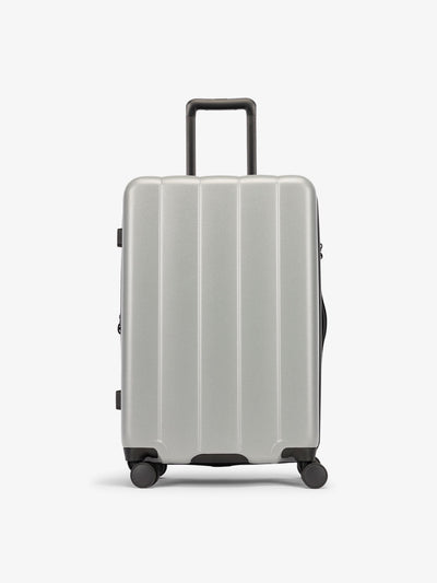 CALPAK Smoke gray medium luggage made from an ultra-durable polycarbonate shell and expandable by up to 2"; LCO1024-SMOKE