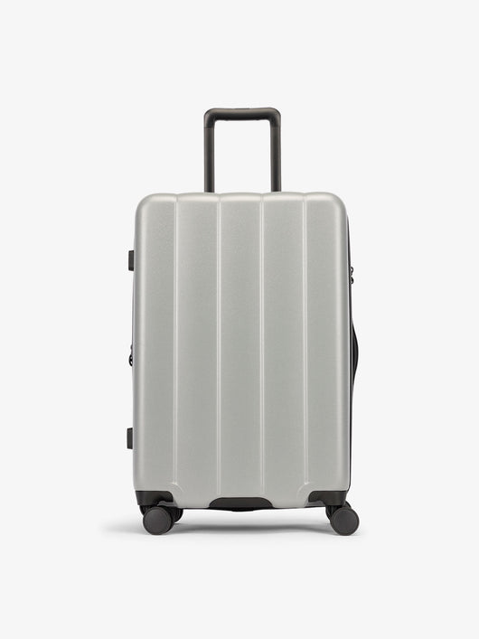 CALPAK Smoke gray medium luggage made from an ultra-durable polycarbonate shell and expandable by up to 2"; LCO1024-SMOKE