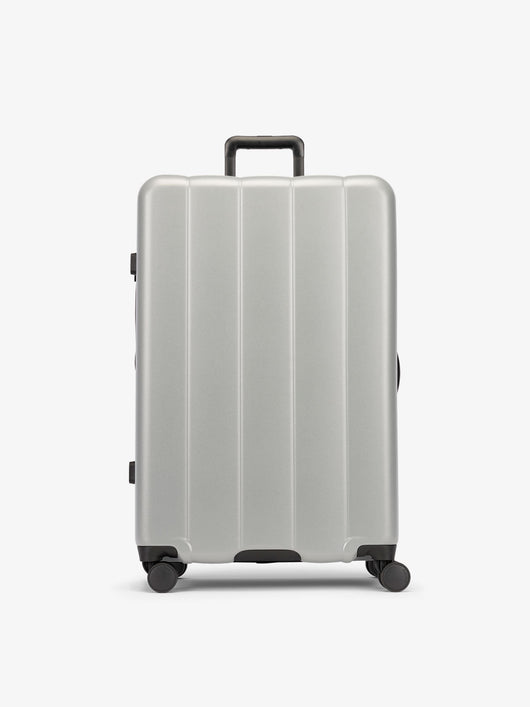 CALPAK Gray smoke large luggage made from an ultra-durable polycarbonate shell and expandable by up to 2"; LCO1028-SMOKE
