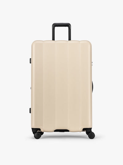 CALPAK Evry Large Luggage in beige exterior and interior polka dot in Polka Dot; LCO1028-POLKA-DOT
