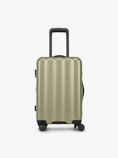 Pistachio green CALPAK carry-on luggage made from an ultra-durable polycarbonate shell and expandable by up to 2"; LCO1020-PISTACHIO