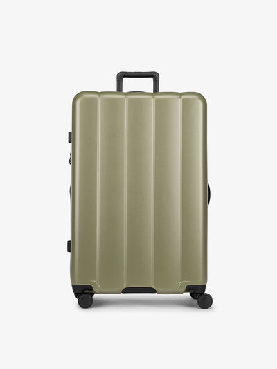 CALPAK Pistachio green large luggage made from an ultra-durable polycarbonate shell and expandable by up to 2"; LCO1028-PISTACHIO