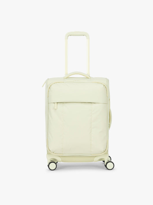 CALPAK Luka Soft-Sided Carry On Luggage in light green Celadon on a white background with handle and spinner wheels; LSM1020-CELADON