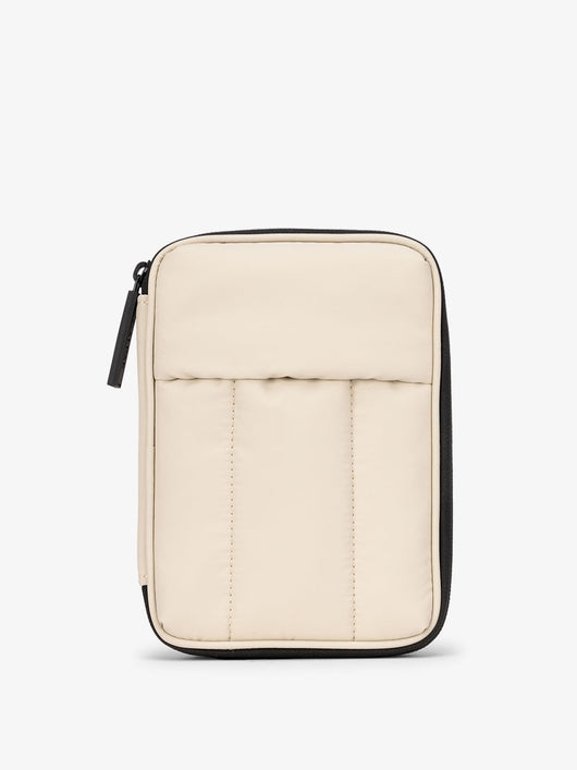 CALPAK Luka Zippered Passport Wallet with soft, puffy exterior in beige oatmeal; PZW2301-OATMEAL