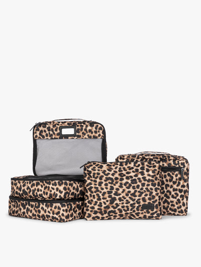 Tan and black animal pattern Leopard CALPAK 5-piece travel packing cubes set which includes three mesh cubes, a flat cube, and a zippered organizer, displayed on a clean white background; PC1601-LEOPARD