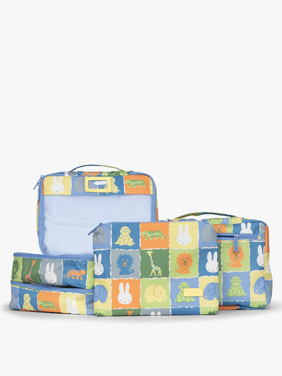 Set of CALPAK Packing Cubes in colorful blue pouches with Miffy and animal pattern on a white background; PC1601-MIFFY-BLUE-ZOO-TRIP