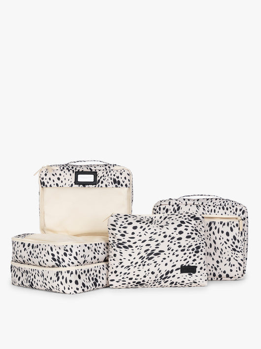 White and black animal pattern Snow Leopard CALPAK 5-piece travel packing cubes set which includes three mesh cubes, a flat cube, and a zippered organizer, displayed on a clean white background; PC1601-SNOW-LEOPARD