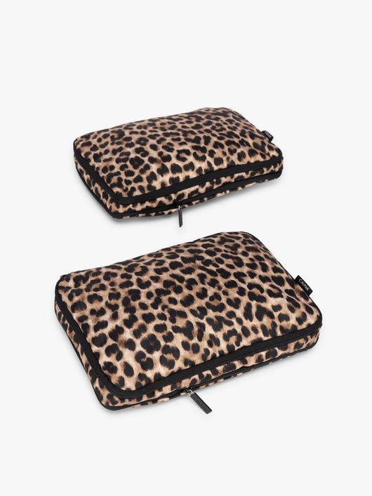 Two tan and black animal print Leopard CALPAK Medium Compression Packing Cubes with zippers shown on a clean white background; PCC2201-LEOPARD