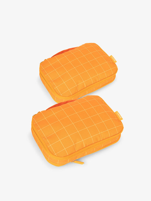 CALPAK small compression packing cubes in orange grid; PCS2301-ORANGE-GRID