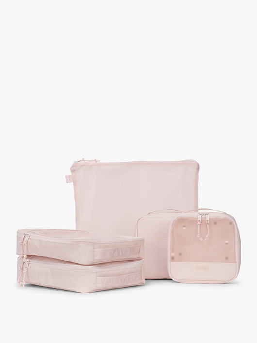 CALPAK Terra 5-Piece Packing Cube Set in pink Shell Pink with two small cubes, two medium cubes, and one large mesh cube with zippers and mesh; PCT2601-SHELL-PINK