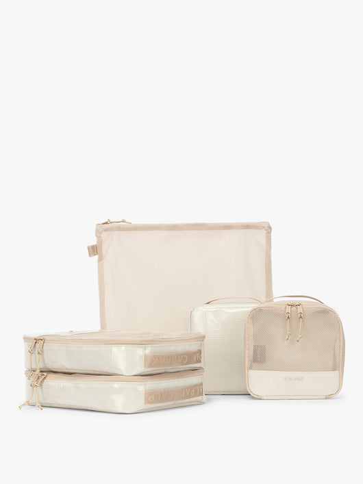 CALPAK Terra 5-Piece Packing Cube Set in off-white beige White Sands with two small cubes, two medium cubes, and one large mesh cube with zippers and mesh; PCT2601-WHITE-SANDS