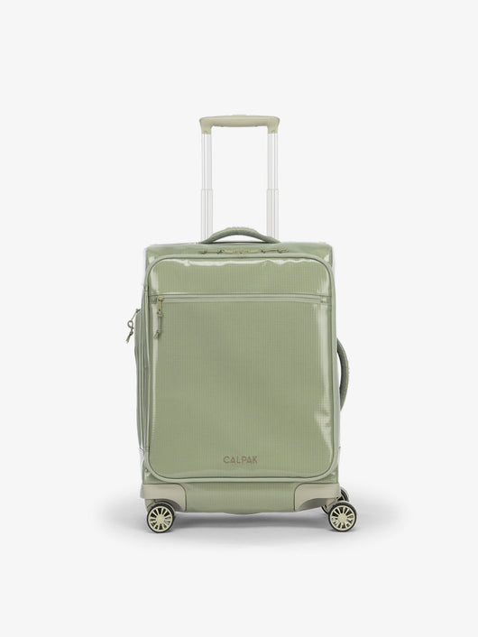 Studio product shot of back-facing CALPAK Terra 35L Carry-On luggage with soft shell and 360 spinner wheels in juniper; LTR1020-JUNIPER