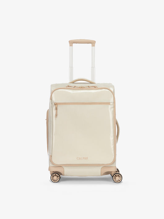Studio product shot of front-facing CALPAK Terra 35L Carry-On luggage with soft shell and 360 spinner wheels in white sands beige; LTR1020-WHITE-SANDS