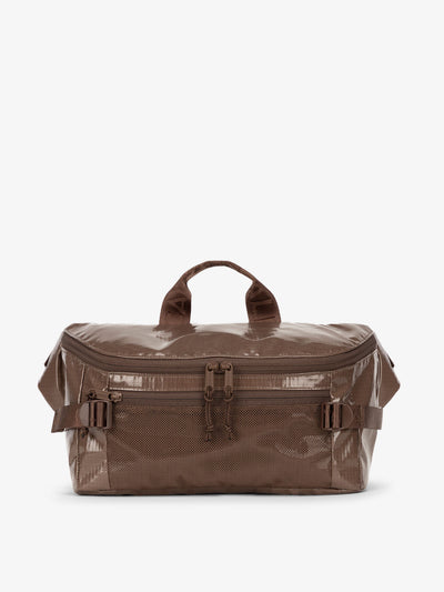 CALPAK Terra Sling Bag with mesh front pocket and top handle in brown cacao; CBH2201-CACAO