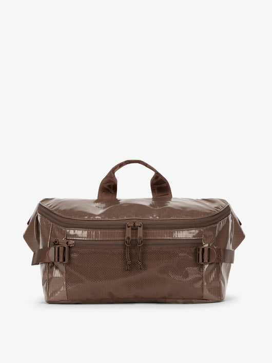 CALPAK Terra Sling Bag with mesh front pocket and top handle in brown cacao; CBH2201-CACAO