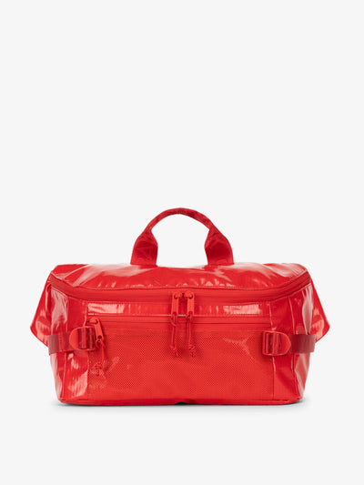 CALPAK Terra Sling Bag with mesh front pocket and top handle in red flame; CBH2201-FLAME