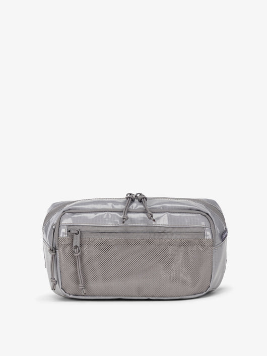 CALPAK Terra small sling bag with mesh front pocket in gray storm; BBT2301-STORM