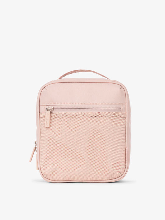 Front-view of CALPAK The Everything Cube made with durable exterior material featuring exterior mesh pocket and top handle in pink sand; ACE2401-PINK-SAND