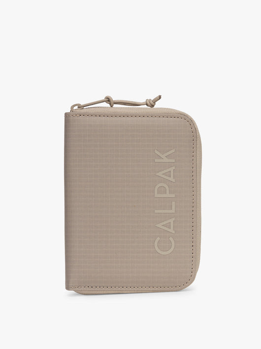 CALPAK Terra Zippered Passport Wallet in beige Stone front view; ATPW2501-STONE