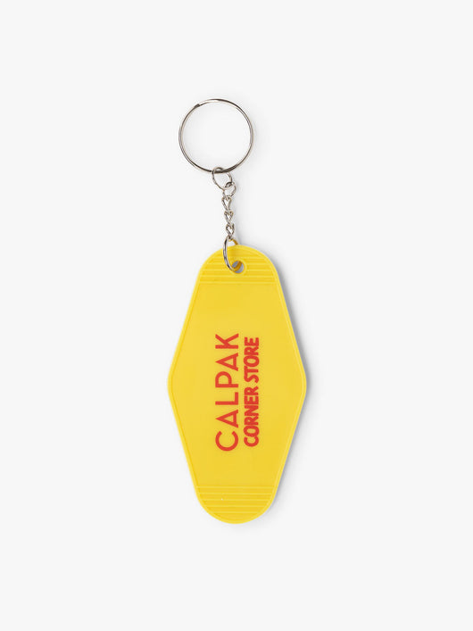 CALPAK yellow key chain with text in red reading CALPAK corner store; CPK2401-CORNER