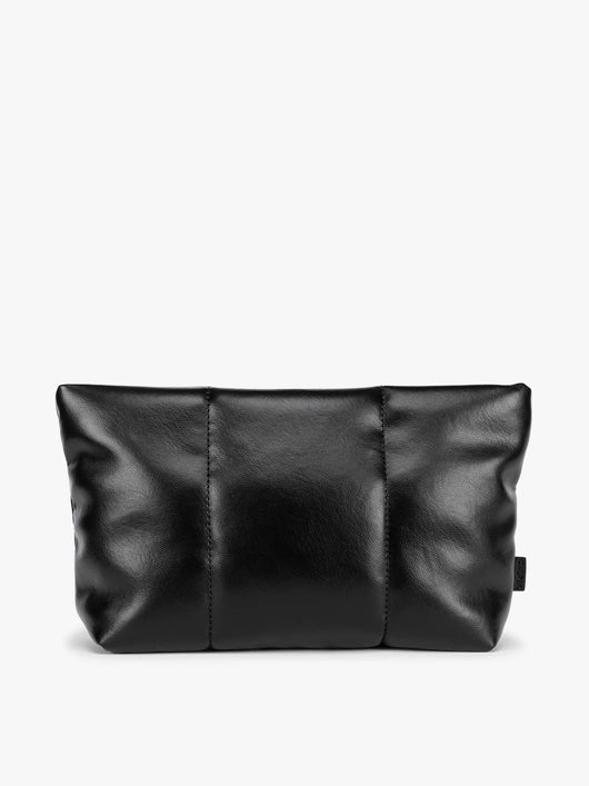 CALPAK black vegan leather pouch bag with a structured rectangular shape and vertical stitched panel details, shown against a plain white background; ZLPM2601-BLACK-PU