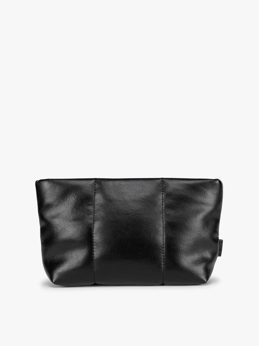 A CALPAK Luka 1 quart black vegan leather pouch bag with a quilted, padded design and a small black brand tag on the right side, shown against a plain white background; ZLPS2601-BLACK-PU