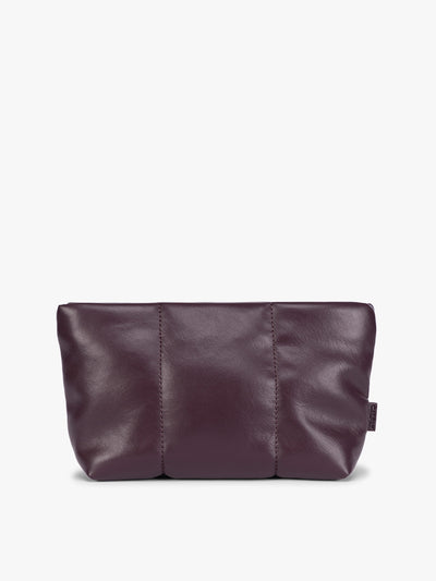 A CALPAK Luka 1 quart deep plum Dark Cherry vegan leather pouch bag with a quilted, padded design and a small brand tag on the right side, shown against a plain white background; ZLPS2601-DARK-CHERRY-PU