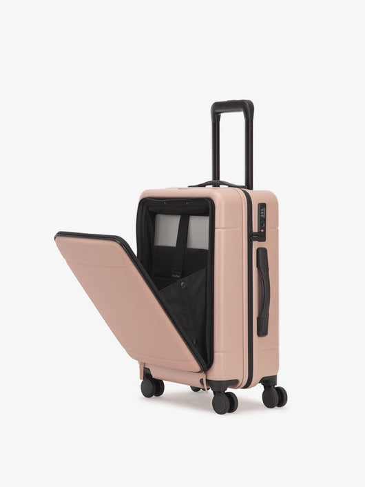 pink CALPAK Hue hard shell carry-on spinner luggage with laptop compartment; LHU1020-PINK-SAND